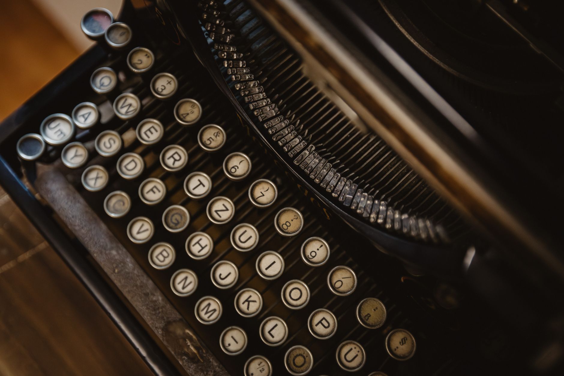 Detailed close-up of vintage typewriter with round keys, showcasing retro design.